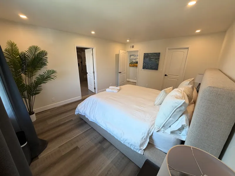 Bright bedroom with lounge seating