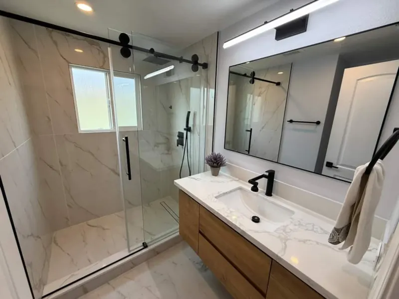 Glass rain shower and floating vanity