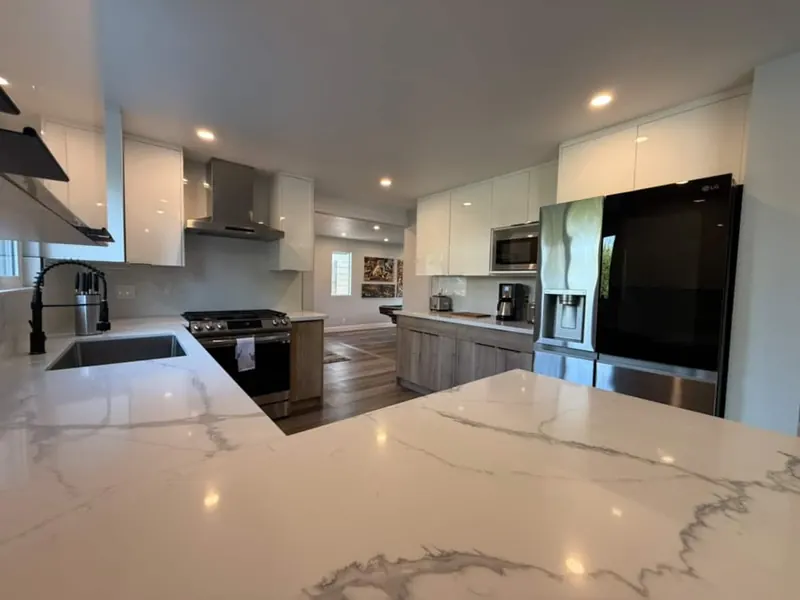 Quartz kitchen with stainless appliances